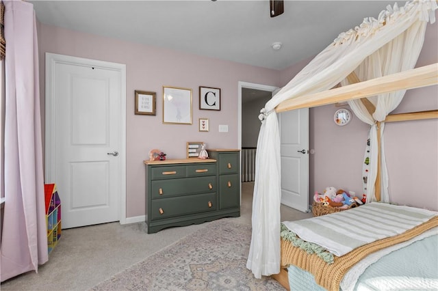 carpeted bedroom with a ceiling fan