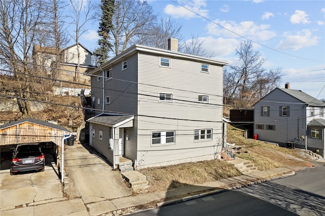 view of front facade featuring a chimney