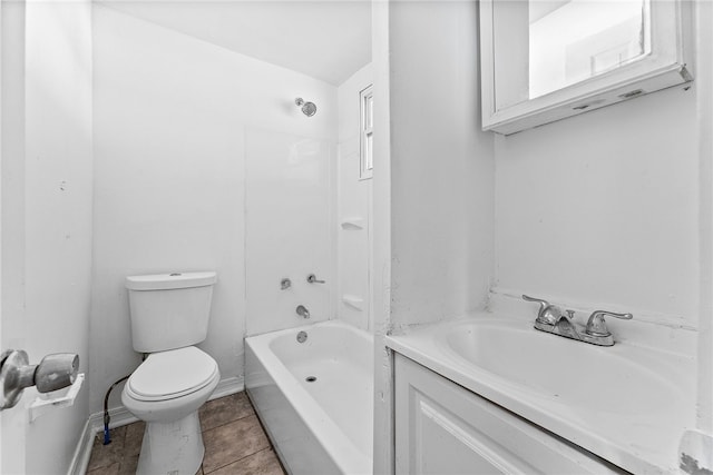 bathroom featuring shower / bath combination, baseboards, toilet, tile patterned floors, and a sink