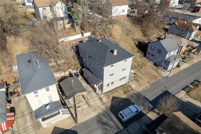 birds eye view of property with a residential view