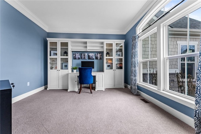 carpeted office featuring baseboards, visible vents, and crown molding