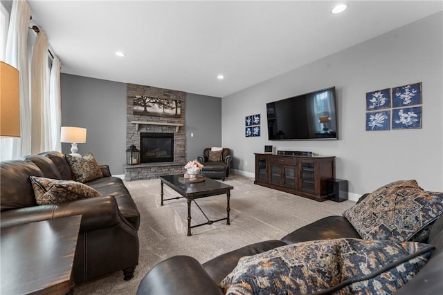 living room featuring carpet, a fireplace, baseboards, and recessed lighting