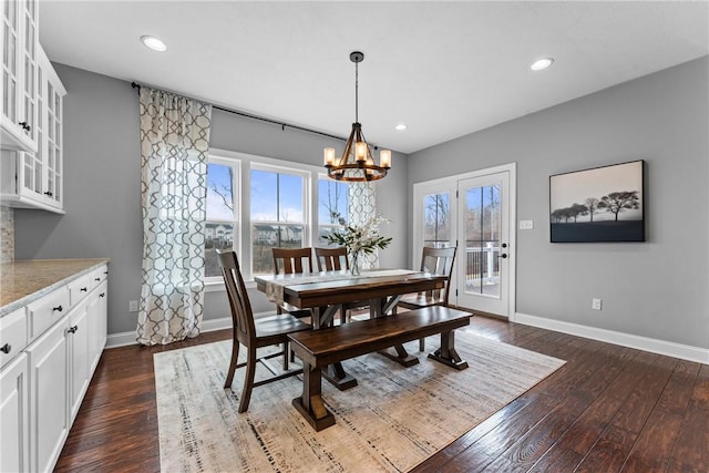 dining room with dark wood-style floors, recessed lighting, a chandelier, and baseboards