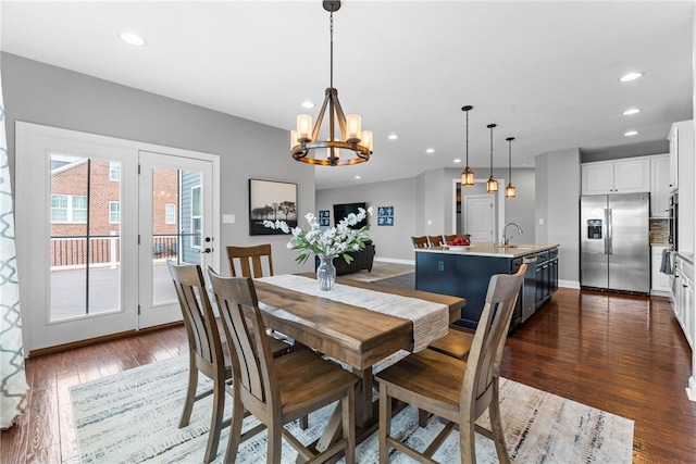 dining space featuring recessed lighting, dark wood finished floors, and baseboards