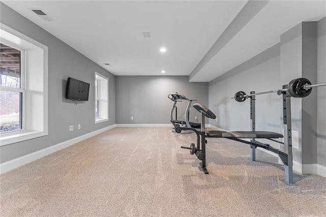 exercise area featuring light carpet, visible vents, baseboards, and recessed lighting