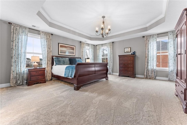 bedroom with a chandelier, a raised ceiling, and baseboards