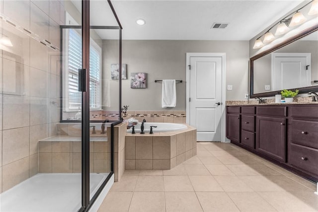 full bath with tile patterned floors, visible vents, a stall shower, vanity, and a bath