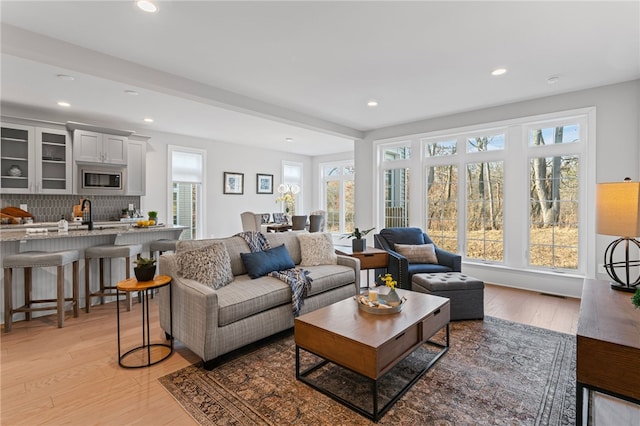 living room featuring light wood-style floors and recessed lighting