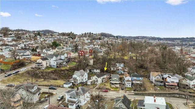 birds eye view of property with a residential view