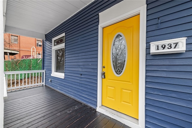 view of exterior entry featuring a porch