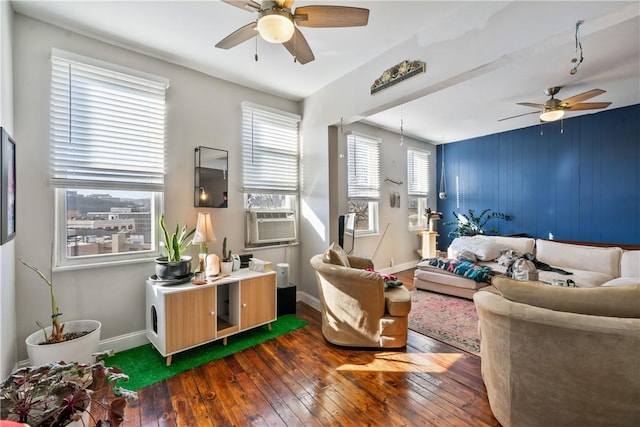 living room with ceiling fan, dark wood-type flooring, cooling unit, and baseboards