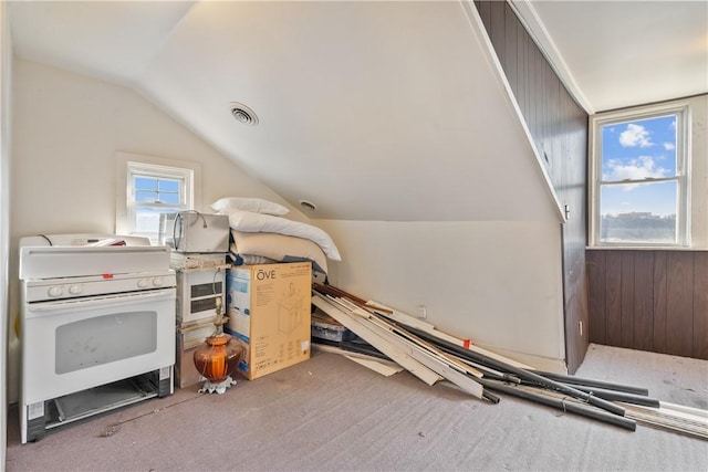 bonus room with carpet floors, visible vents, and vaulted ceiling