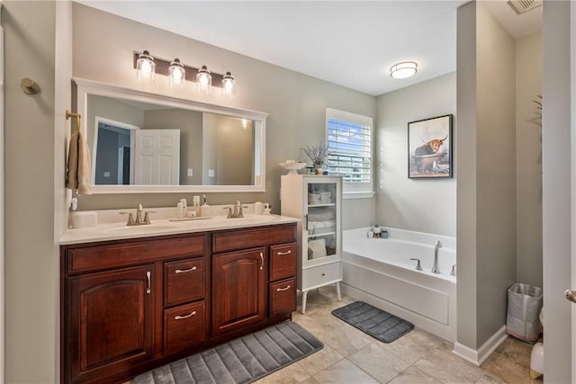 full bathroom featuring a garden tub, double vanity, a sink, and visible vents