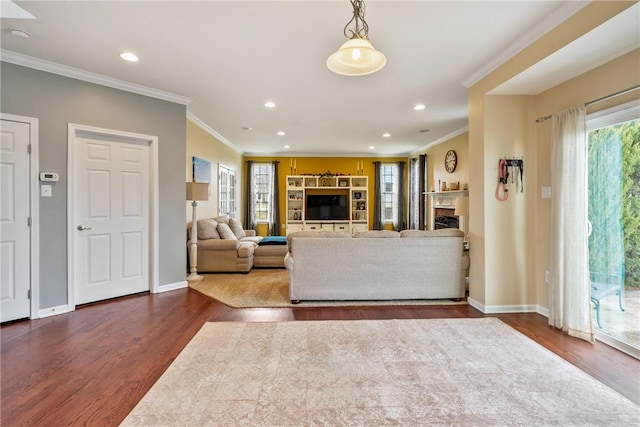 unfurnished living room featuring recessed lighting, a fireplace, baseboards, dark wood-style floors, and crown molding