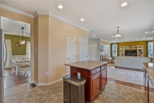 kitchen with pendant lighting, ornamental molding, and recessed lighting