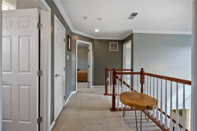 corridor featuring baseboards, an upstairs landing, visible vents, and light colored carpet