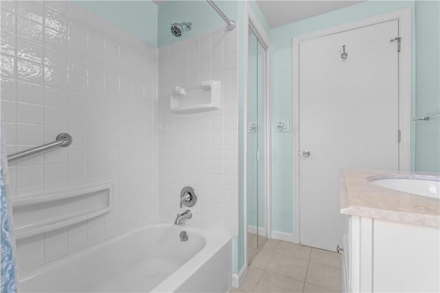 bathroom featuring shower / tub combo, vanity, baseboards, and tile patterned floors