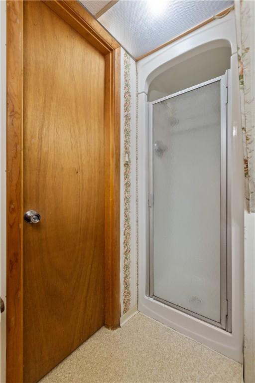 bathroom featuring a stall shower