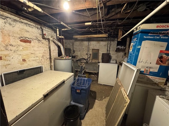 unfinished below grade area featuring washer / clothes dryer and gas water heater