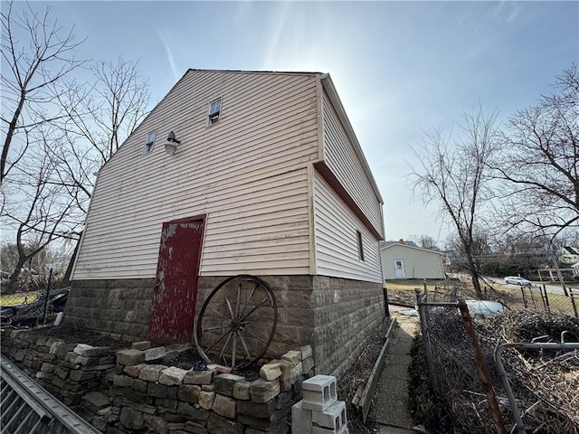 view of property exterior featuring an outdoor structure