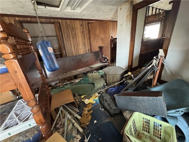 miscellaneous room featuring wooden walls