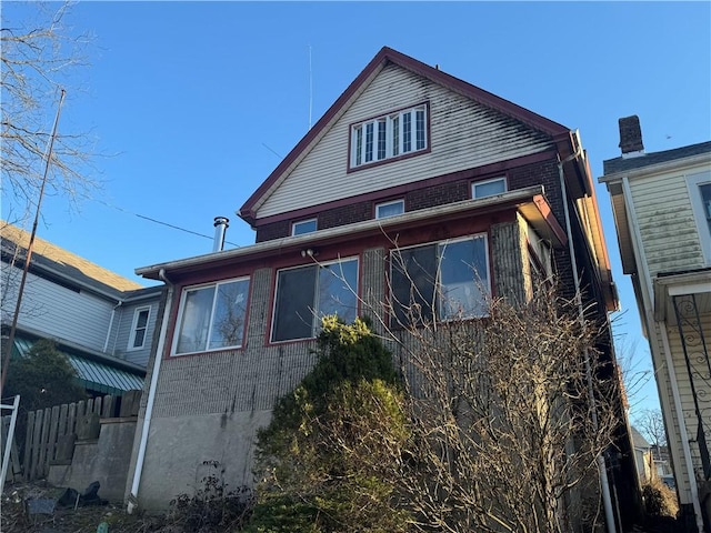 view of home's exterior with brick siding