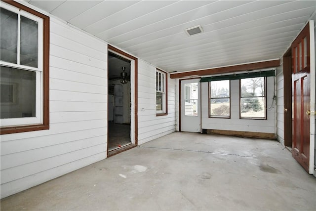 unfurnished sunroom with visible vents