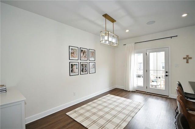 doorway with recessed lighting, dark wood finished floors, and baseboards