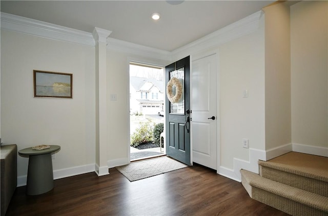 entryway featuring baseboards, dark wood-type flooring, crown molding, and recessed lighting