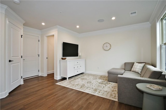 living area with crown molding, visible vents, dark wood-type flooring, and recessed lighting