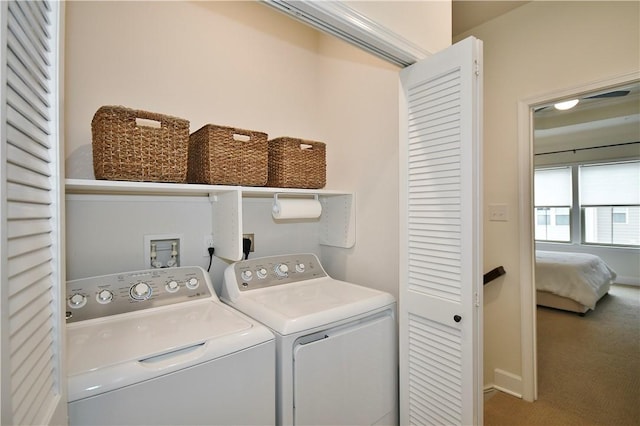 laundry area featuring laundry area, independent washer and dryer, carpet flooring, and baseboards