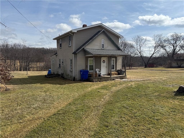 traditional-style house with a front lawn