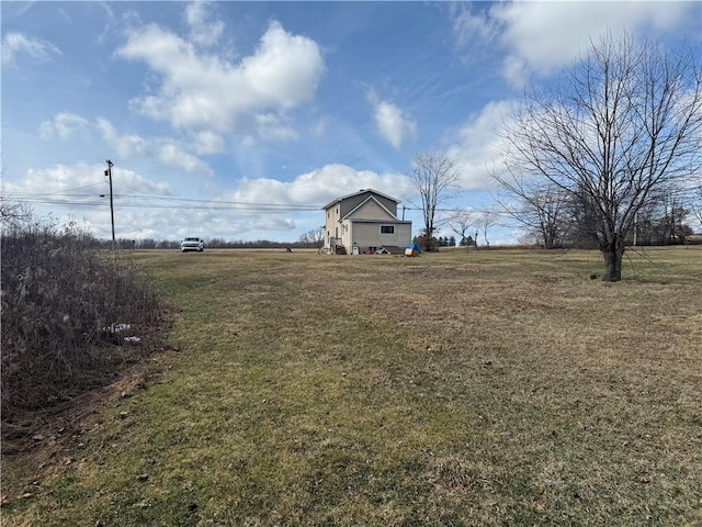 view of yard with a rural view