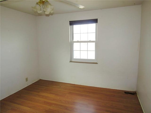 empty room featuring wood finished floors