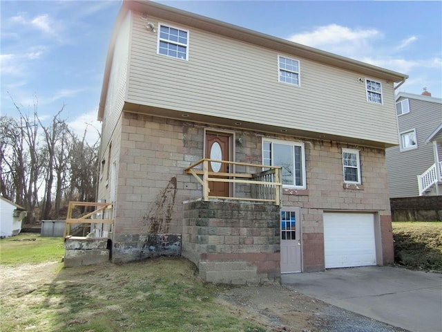 view of front facade featuring a garage and concrete driveway