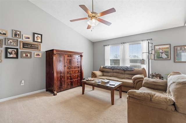 living room with baseboards, vaulted ceiling, a ceiling fan, and light colored carpet