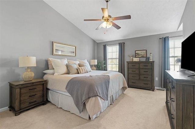 bedroom with light carpet, multiple windows, lofted ceiling, and baseboards