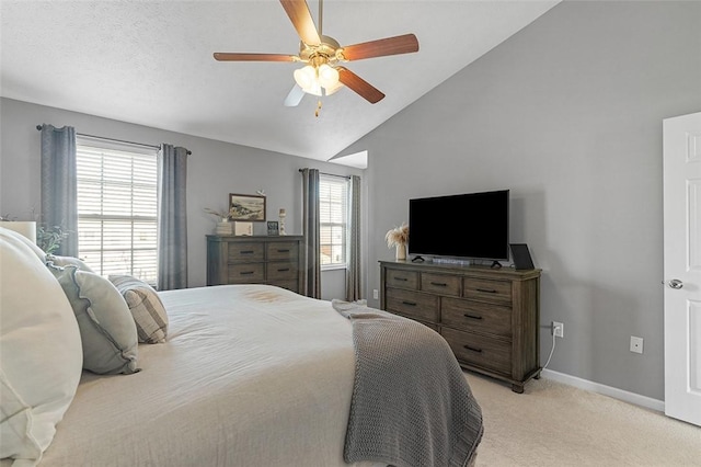 bedroom with light carpet, multiple windows, baseboards, and lofted ceiling