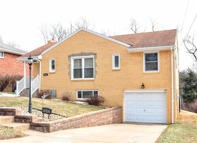 view of front of home featuring driveway, an attached garage, a front lawn, and brick siding