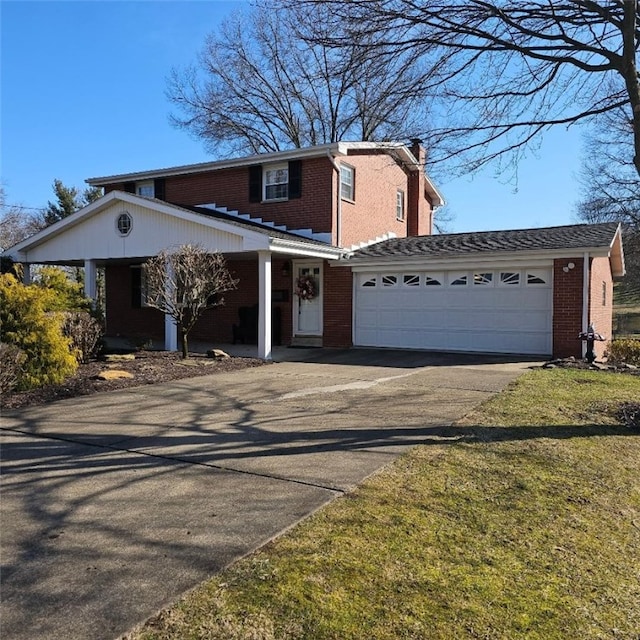 view of front of property featuring brick siding, a chimney, concrete driveway, an attached garage, and a front lawn