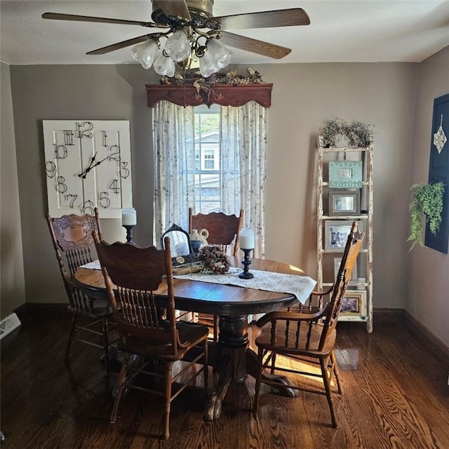 dining space featuring a ceiling fan, baseboards, and wood finished floors