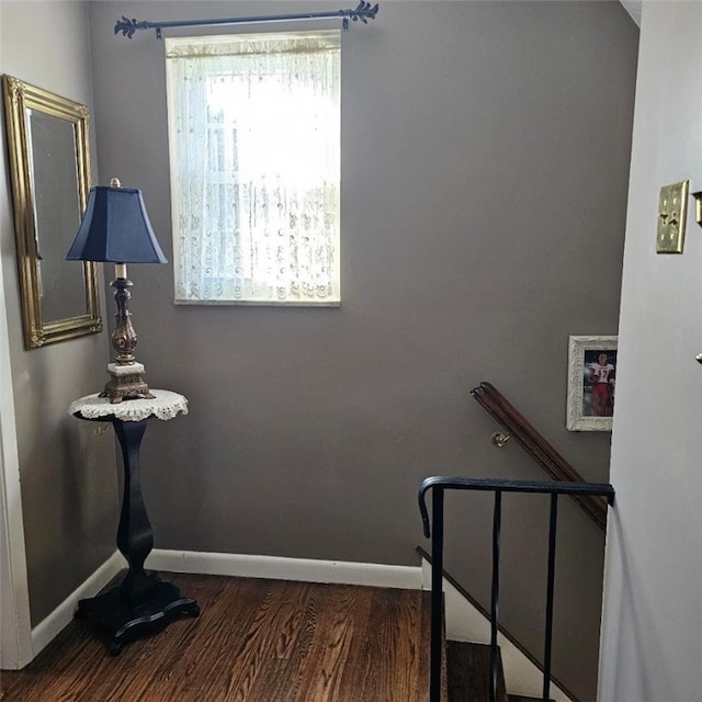 stairs featuring baseboards and wood finished floors