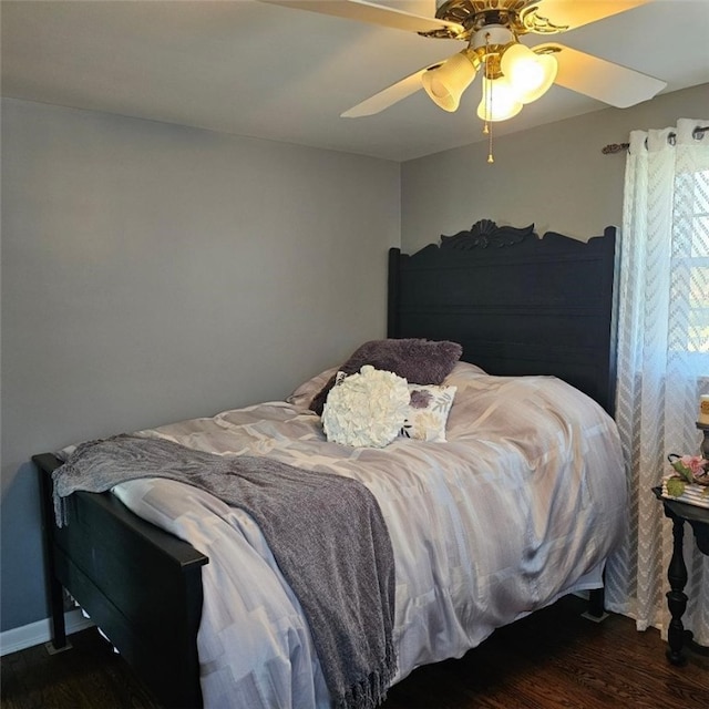 bedroom featuring a ceiling fan and wood finished floors