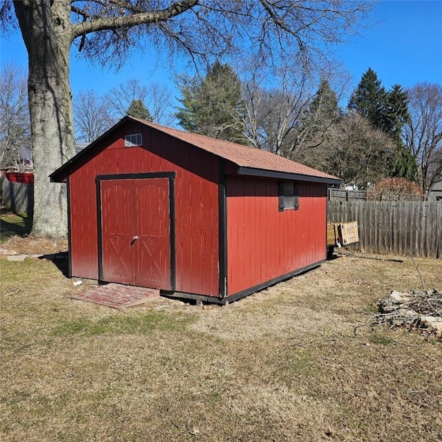 view of shed with fence