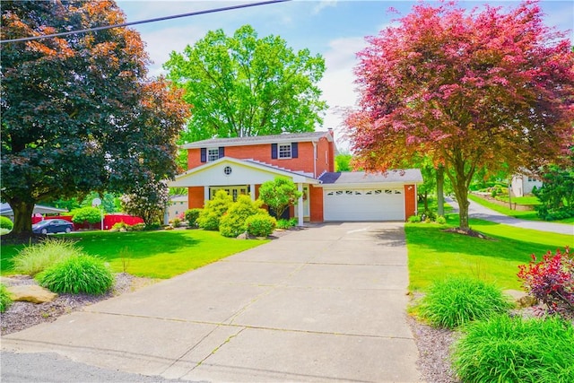 127 Stickle Rd, Chippewa Twp, PA 15010 - view of front facade with a garage, a front lawn, driveway, and brick siding
