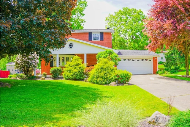 127 Stickle Rd, Chippewa Twp, PA 15010 - traditional-style home with brick siding, concrete driveway, an attached garage, and a front yard