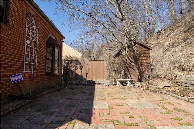 view of patio featuring fence