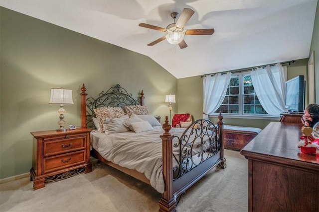 bedroom featuring ceiling fan, baseboards, vaulted ceiling, and light colored carpet