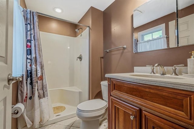 full bathroom with toilet, curtained shower, vanity, and tile patterned floors