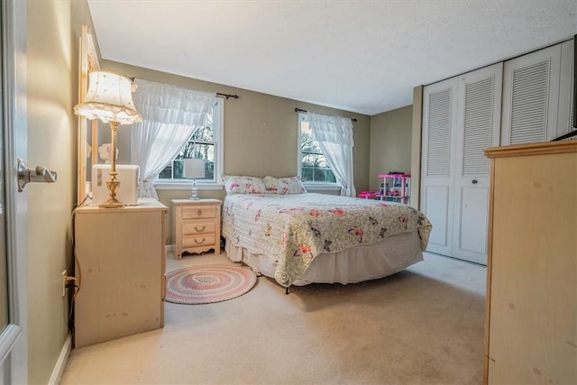 bedroom featuring a closet and carpet